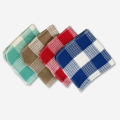 Colored dishcloths, green, brown, red and blue stacked on each other on a white background.