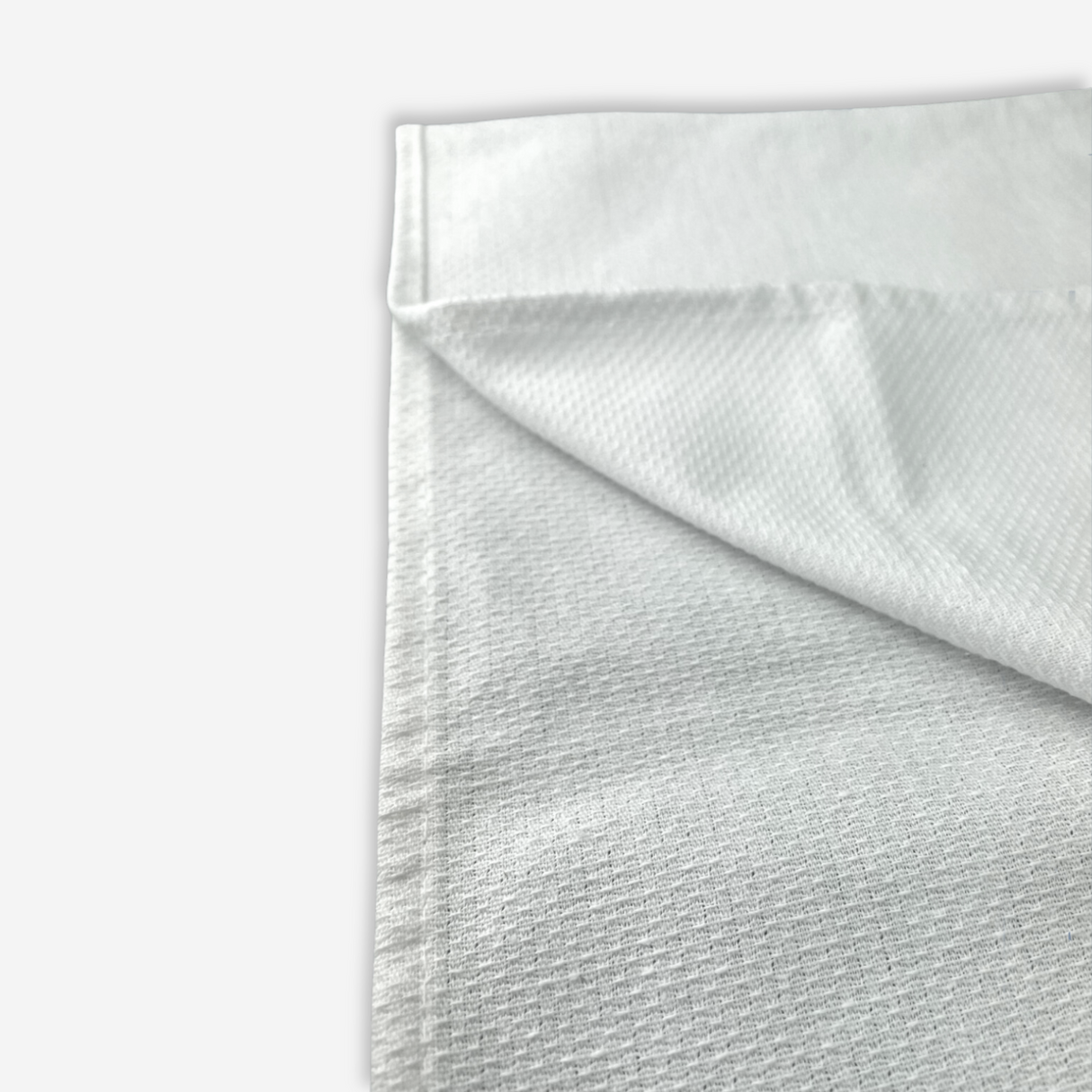 Close up view on a white tuck towel folded.