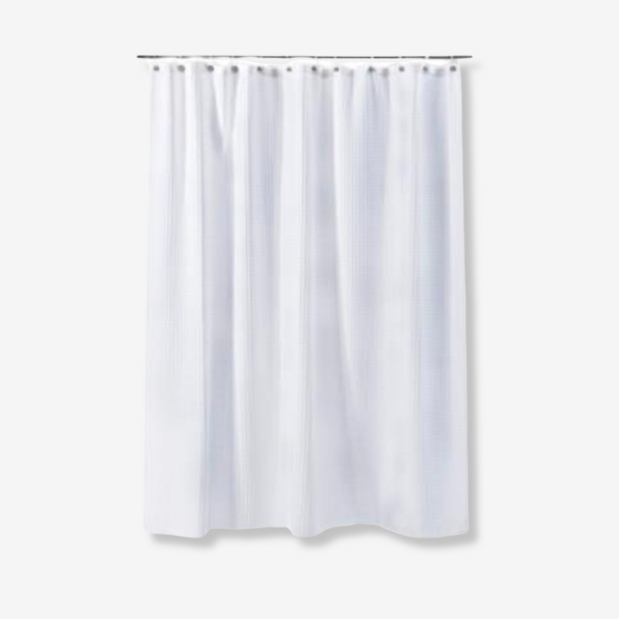 White waffled shower curtain on a white background