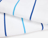 Folded pool towel, white with small dark blue and light blue stripes.