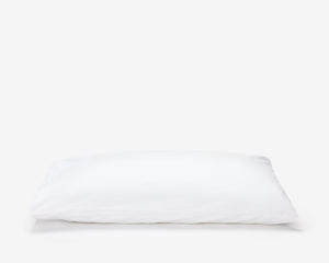 White hotel pillow featuring a white pillow protector with flap.