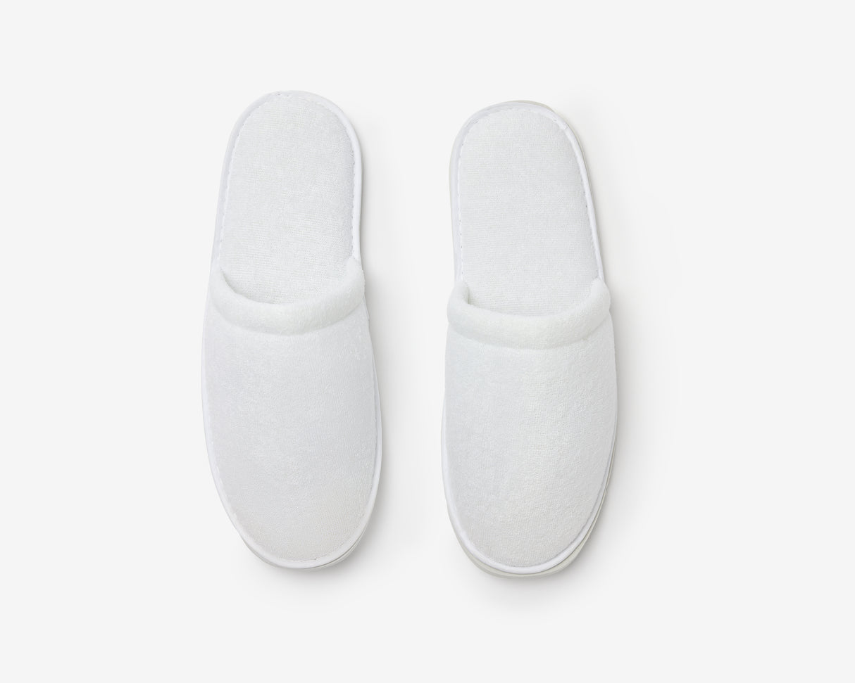 White closed toe slippers, view from above
