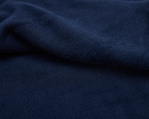 Navy polar fleece blanket.