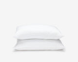 White hotel economic pillows, one on top of the other 