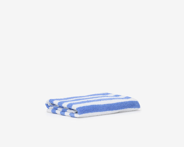 Folded pool towel with blue and white stripes.