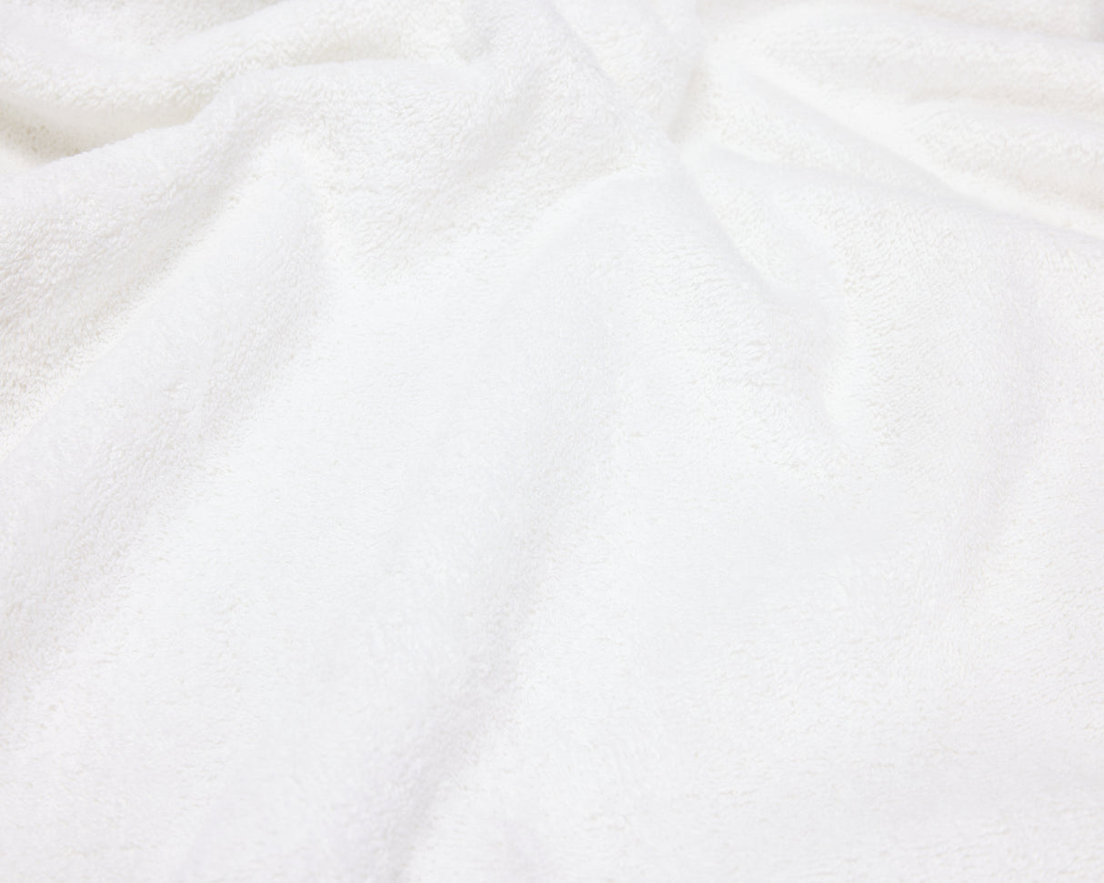 Close up view of a white hotel towel.
