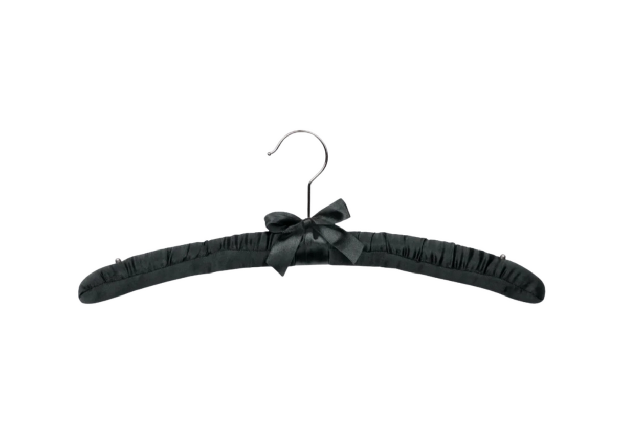 Hotel black satin hanger with a bow on a white background 