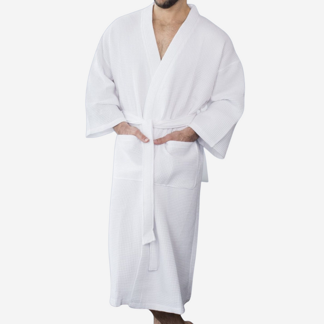 Men wearing a white hotel bathrobe.