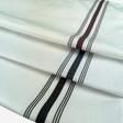 White bistro napkins featuring colored striped.