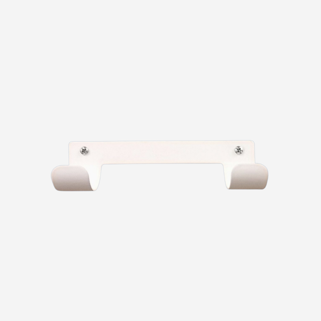 White wall mount ironing board holder on a white background